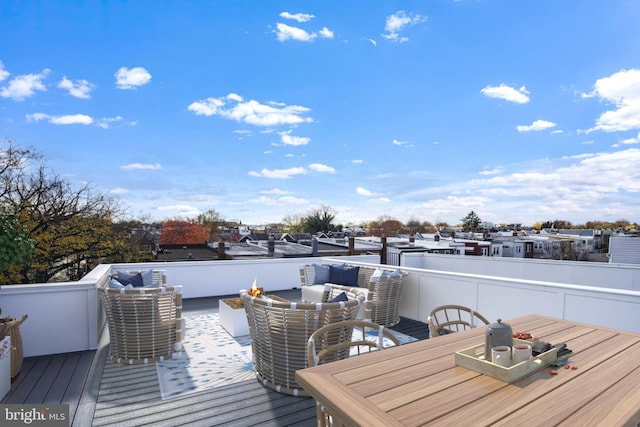 wooden deck featuring an outdoor living space and outdoor dining space