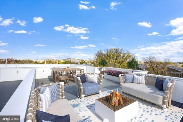 view of patio / terrace featuring an outdoor living space with a fire pit