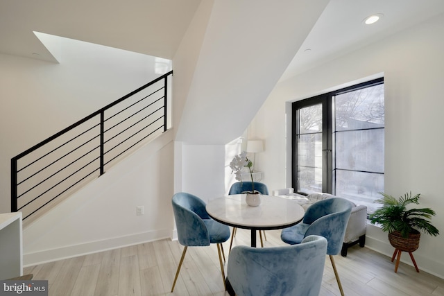 dining space featuring stairway, recessed lighting, light wood-style flooring, and baseboards