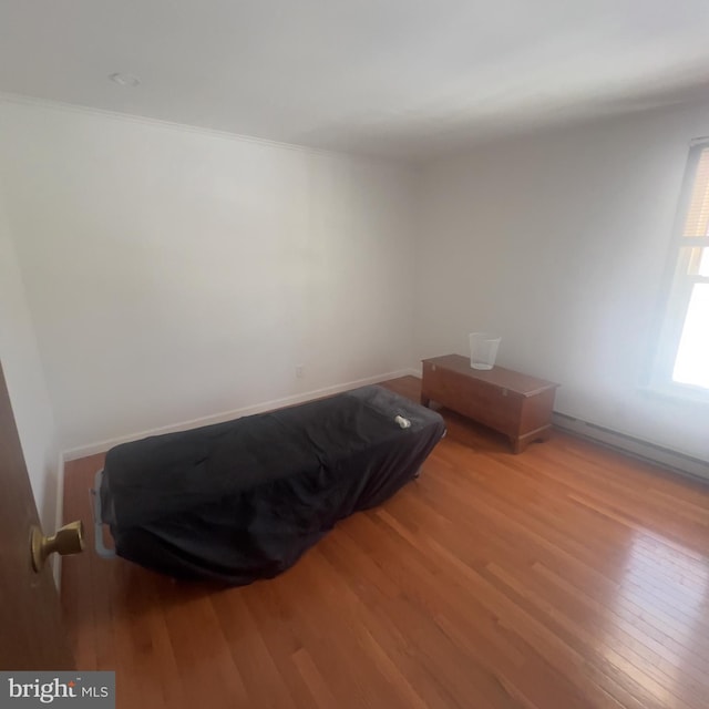 bedroom with wood finished floors