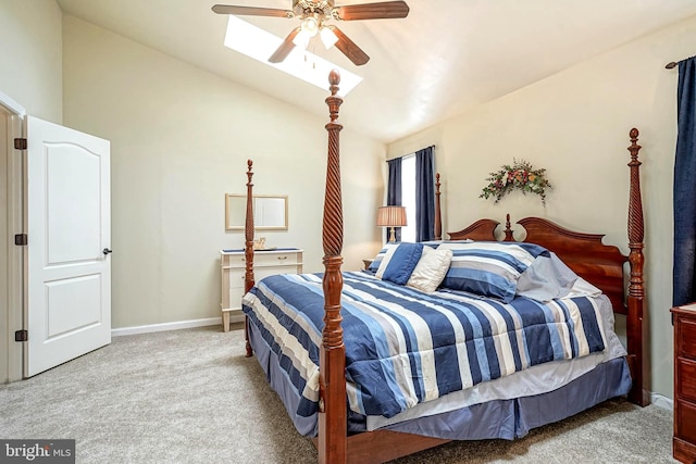 carpeted bedroom with baseboards, vaulted ceiling, and a ceiling fan