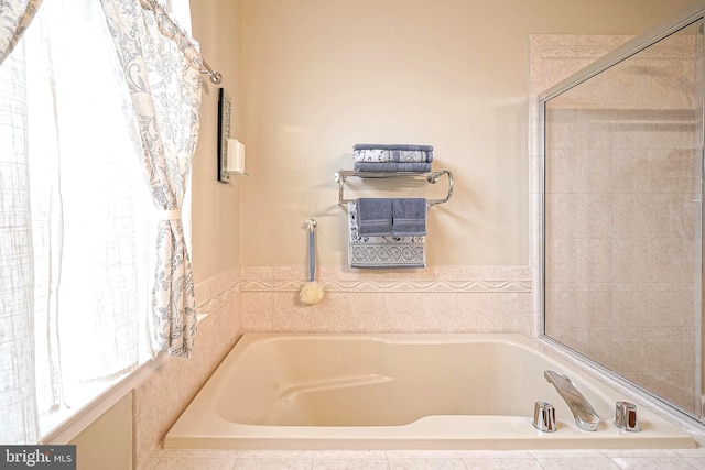 full bathroom featuring a garden tub