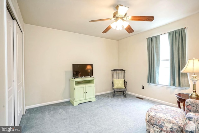 sitting room with carpet floors, plenty of natural light, visible vents, and baseboards