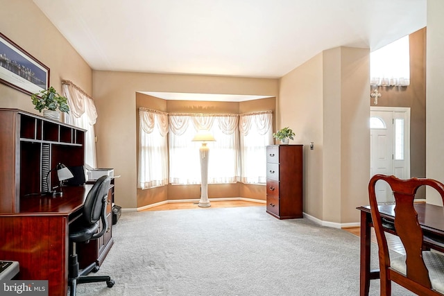 carpeted office with baseboards