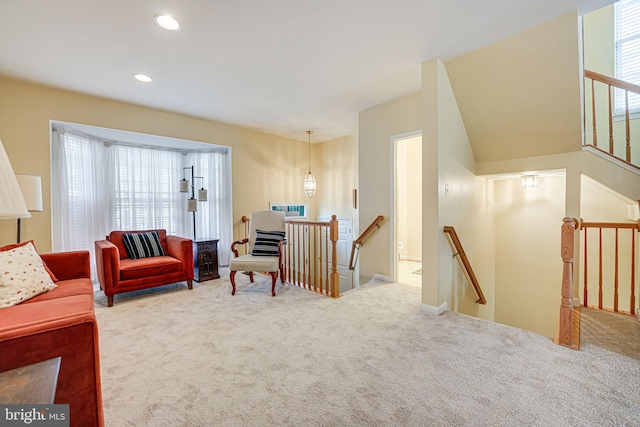 carpeted living area with recessed lighting