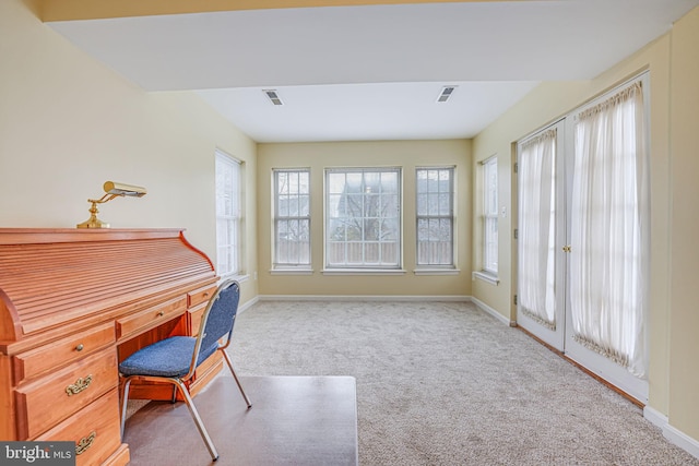 carpeted home office featuring visible vents and baseboards