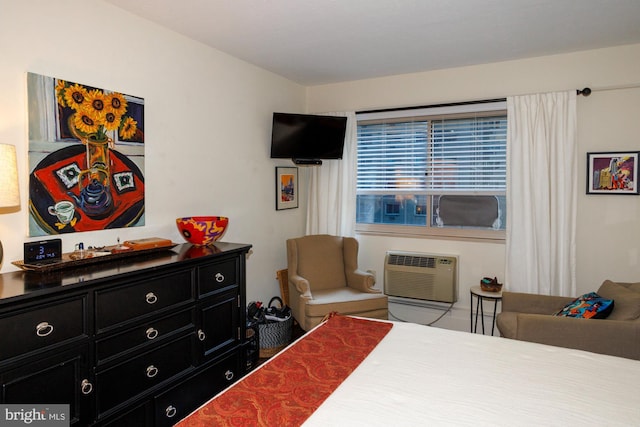 bedroom with a wall mounted air conditioner