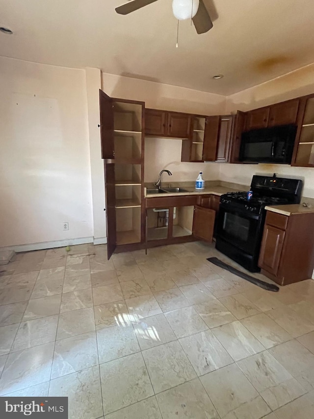 kitchen featuring open shelves, light countertops, a ceiling fan, a sink, and black appliances