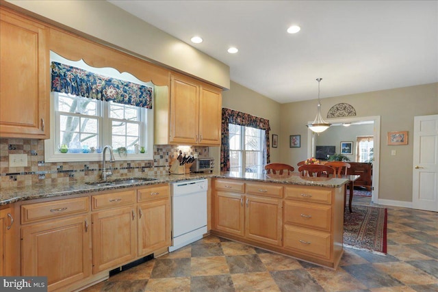 kitchen with decorative backsplash, dishwasher, a peninsula, pendant lighting, and a sink