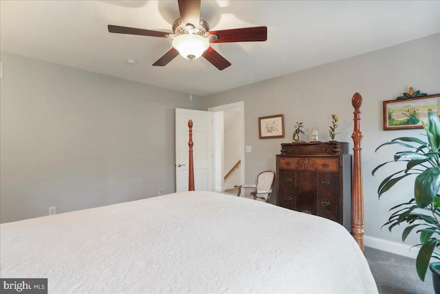 carpeted bedroom featuring a ceiling fan and baseboards