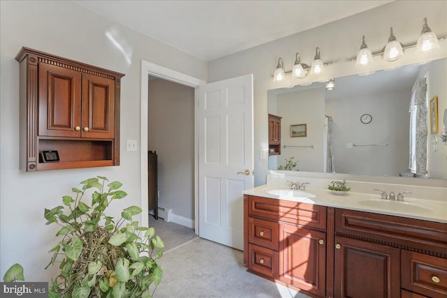 bathroom featuring a baseboard heating unit, a shower with curtain, a sink, and double vanity