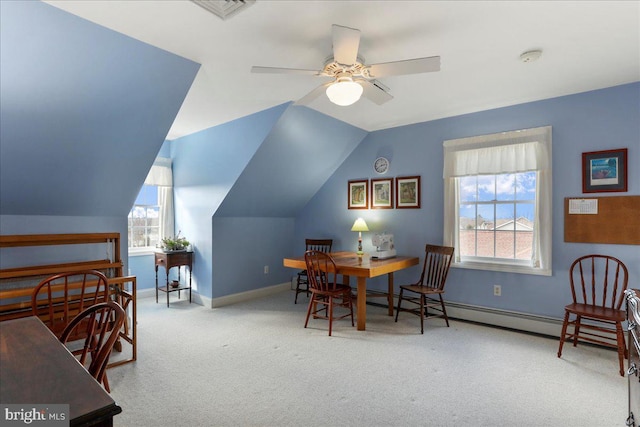 dining room with light colored carpet, visible vents, a ceiling fan, vaulted ceiling, and baseboards