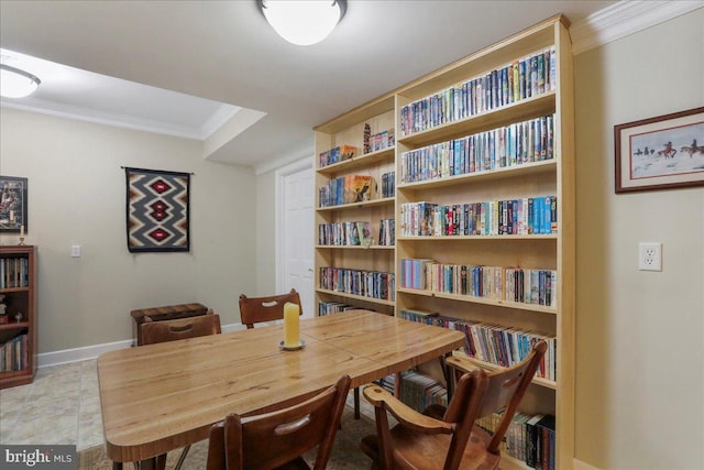 dining area featuring ornamental molding and baseboards
