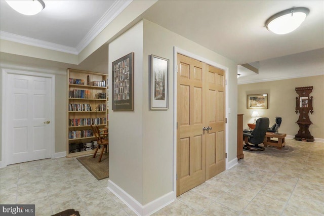 corridor featuring baseboards, light tile patterned flooring, and crown molding