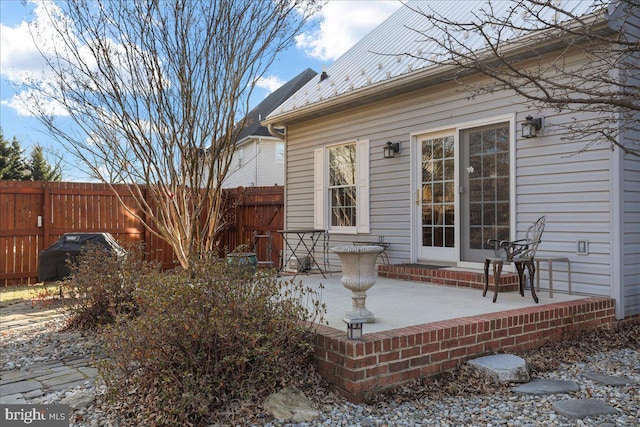 view of patio / terrace featuring fence