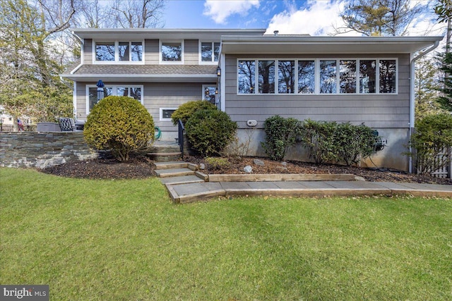 split level home with a front yard