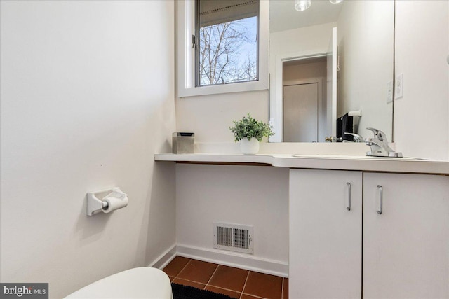 bathroom featuring toilet, baseboards, visible vents, and vanity