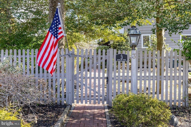 view of gate featuring fence