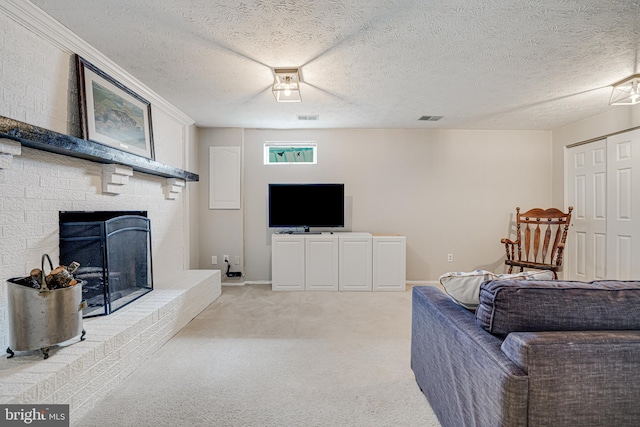 living room with a textured ceiling, a brick fireplace, visible vents, and light colored carpet