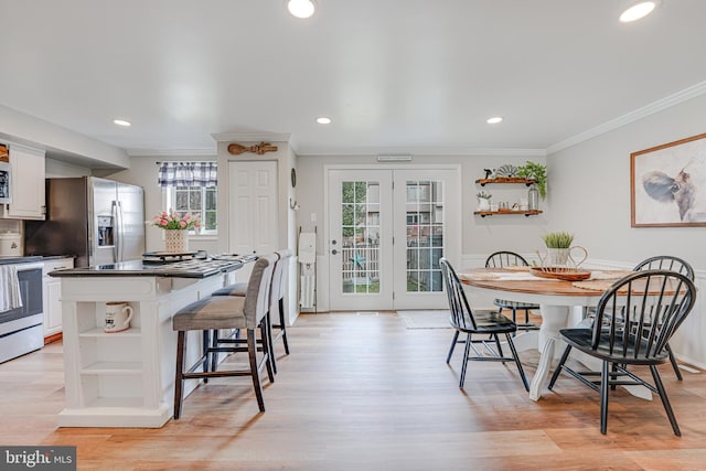 kitchen with stainless steel appliances, a wealth of natural light, and open shelves