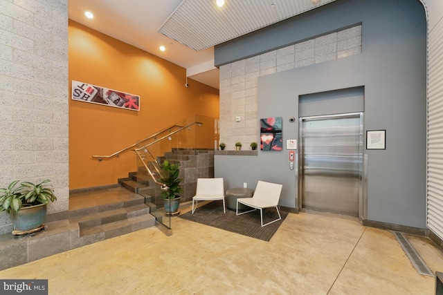 community lobby with stairs and visible vents