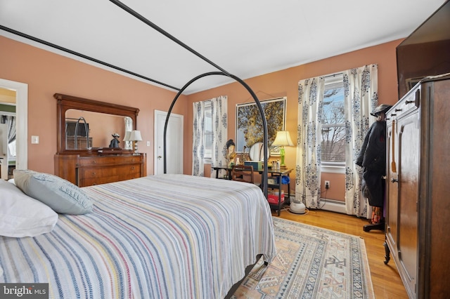 bedroom with light wood-style floors