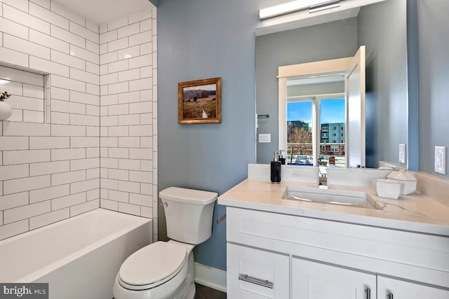 bathroom featuring vanity, toilet, and shower / bathtub combination