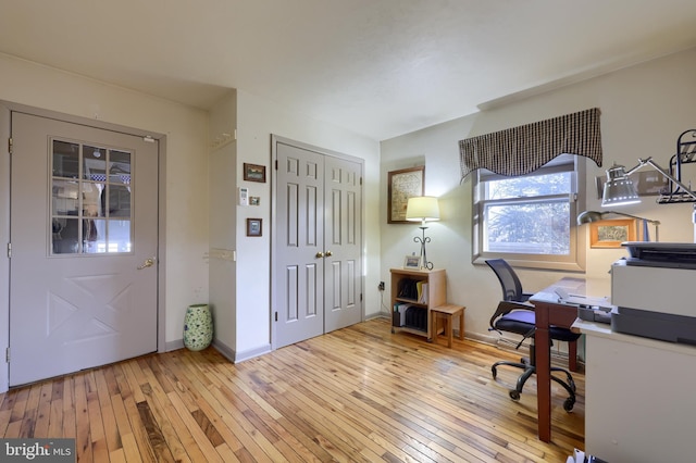 office featuring light wood-type flooring and baseboards