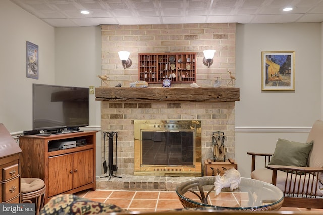 living area with recessed lighting, a fireplace, and light tile patterned floors