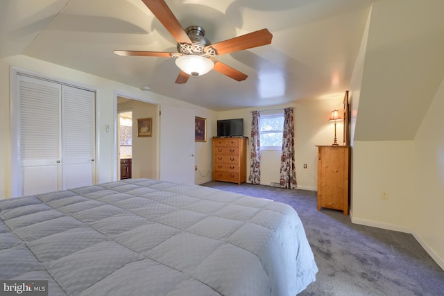 carpeted bedroom featuring a ceiling fan, lofted ceiling, and baseboards