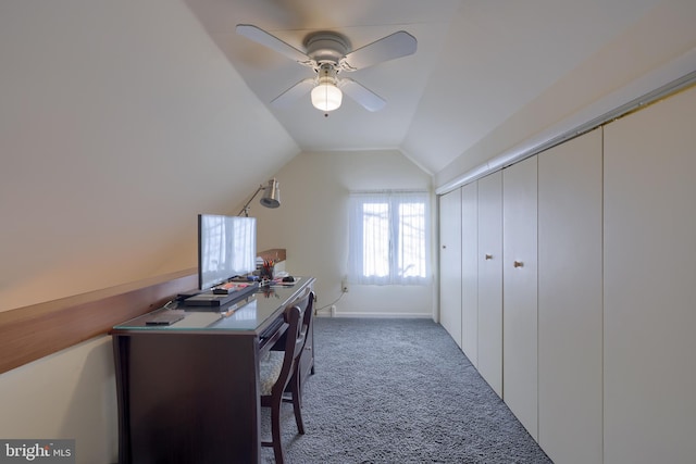 office featuring lofted ceiling, carpet, and a ceiling fan