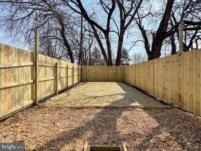 view of yard with a fenced backyard