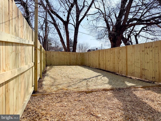 view of yard featuring a fenced backyard