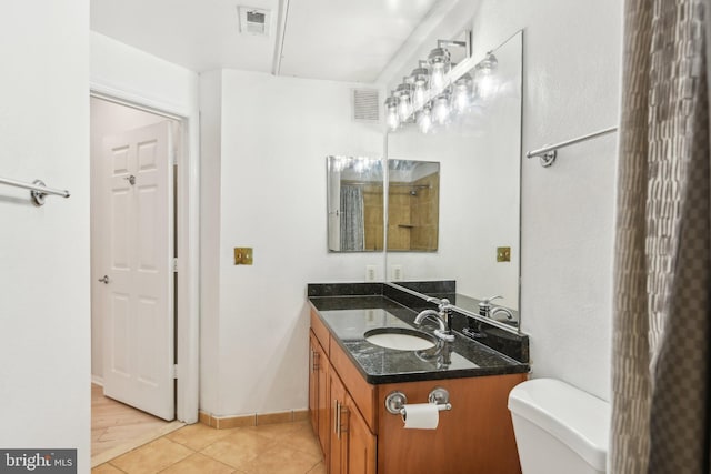 bathroom featuring toilet, tile patterned flooring, visible vents, and vanity