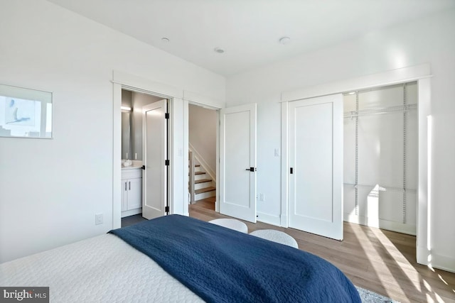 1605 Holbrook NE Unit 4, Washington, DC 20002 - bedroom featuring a closet, wood finished floors, and connected bathroom
