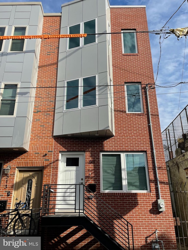 view of front of home with brick siding