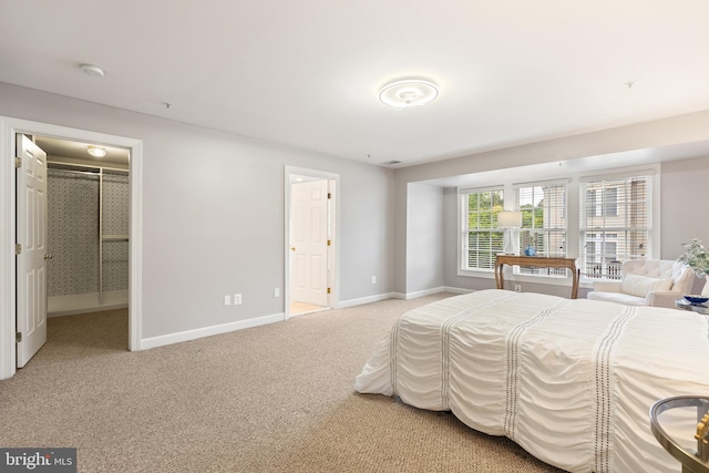 carpeted bedroom featuring baseboards