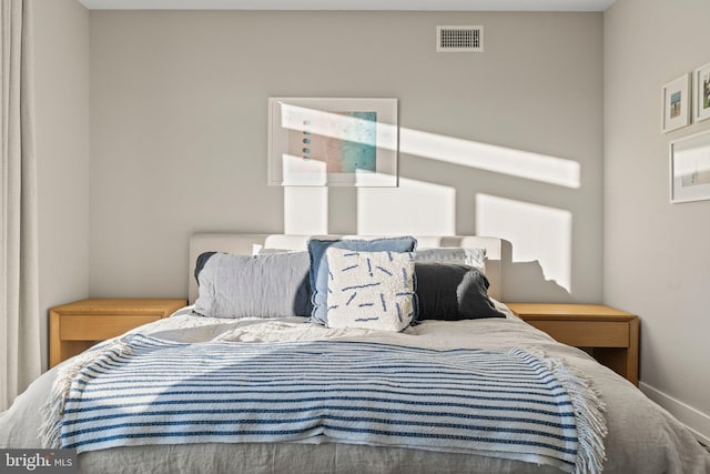 bedroom featuring visible vents