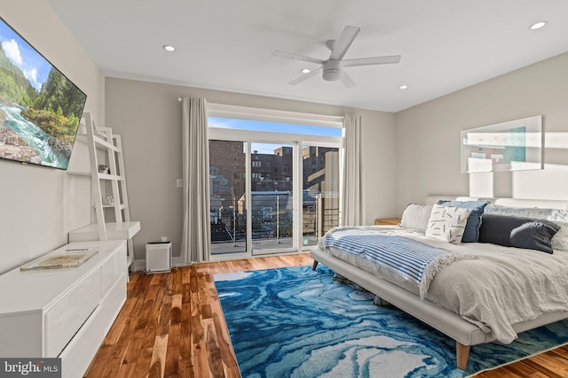 bedroom featuring access to exterior, recessed lighting, ceiling fan, and wood finished floors