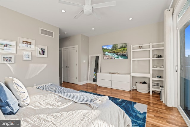 bedroom featuring a ceiling fan, recessed lighting, visible vents, and wood finished floors