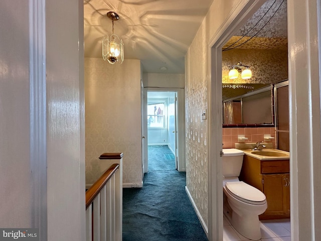 bathroom with backsplash, toilet, tile walls, and vanity