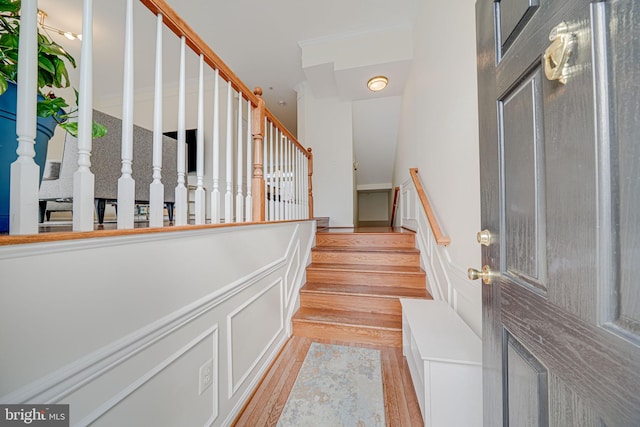 interior space with light wood-style floors and stairway