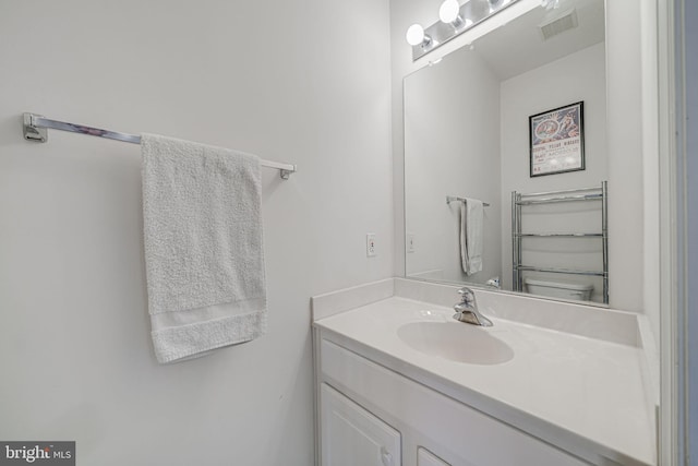 bathroom featuring vanity and visible vents