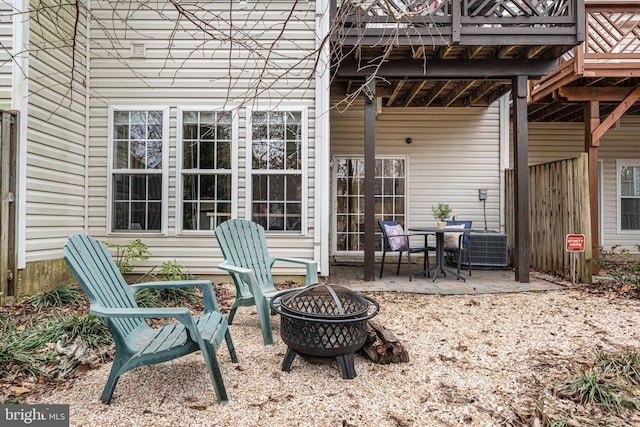 view of patio / terrace with fence and a fire pit