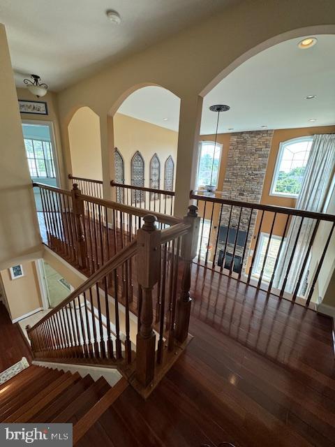 stairway featuring wood finished floors