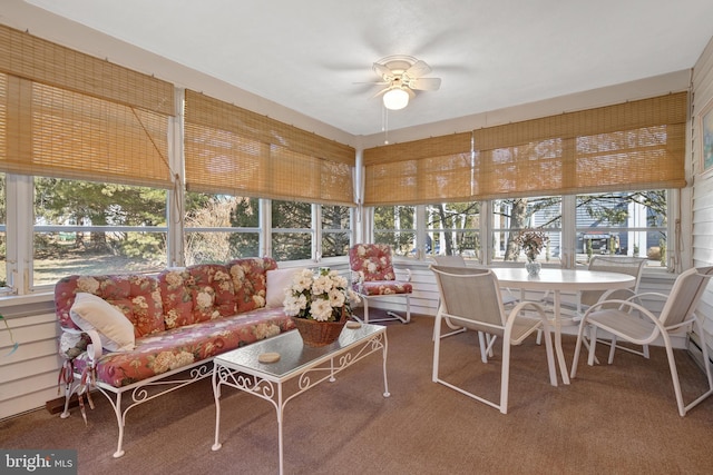 sunroom / solarium with ceiling fan