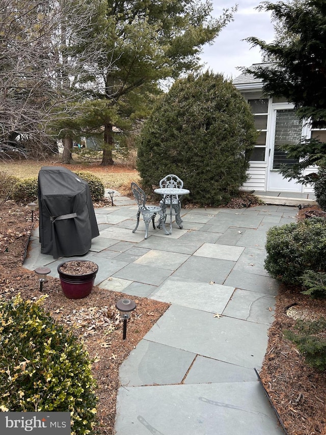 view of patio with a grill