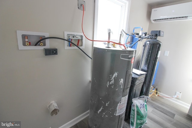 utilities featuring an AC wall unit and electric water heater