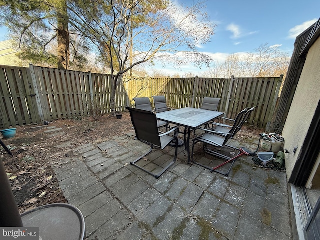 view of patio / terrace with a fenced backyard and outdoor dining area