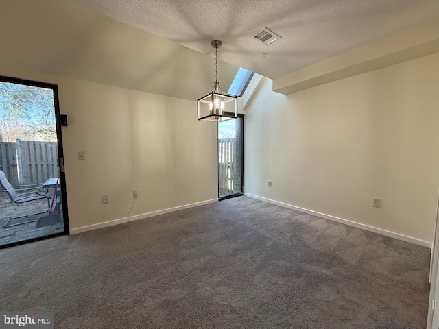 unfurnished room featuring a wealth of natural light, lofted ceiling, baseboards, and dark colored carpet